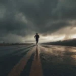 A lone athlete running at dawn, symbolizing discipline and consistency.